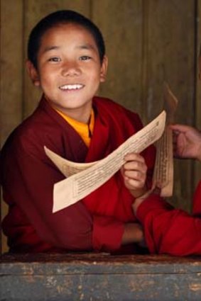 Young monks learning religious texts in the Temple of the Divine Madman in the Bhutanese town of Punakha.