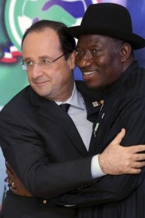 'Your struggle is our struggle'  ... French President Francois Hollande hugs Nigerian President Goodluck Jonathan (right) after they opened the Nigeria-France business forum in Abuja on Thursday.