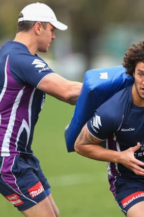 Hair-raising: Storm's Kevin Proctor takes a hit from the bag during training yesterday.