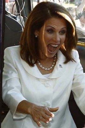 Controversial figure: Michele Bachmann reacts as she steps off her bus to greet supporters after winning the Ames straw poll.
