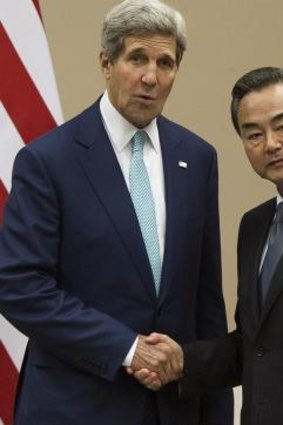 Tensions: US Secretary of State John Kerry (left) and Chinese Foreign Minister Wang Yi at the ASEAN summit.