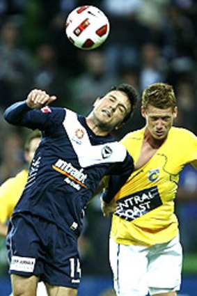 Victory's Billy Celeski (left) duels with Oliver Bozanic of the Mariners.