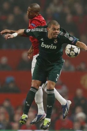 Manchester United's Ashley Young (left) challenges Real Madrid's Pepe.