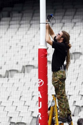 A camera is fitted to the goal post for the 2008 Hall of Fame Tribute match at the MCG.