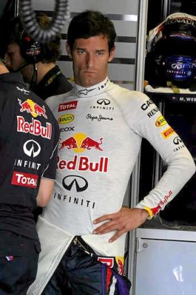 Red Bull Racing's Australian driver Mark Webber stands  in the pits during the third practice session at the Hungarian Grand Prix.