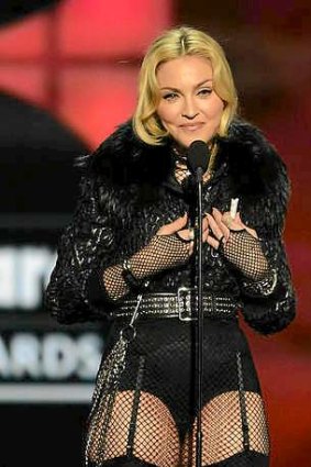Madonna accepts the award for "Touring Artist of the Year" onstage during the 2013 Billboard Music Awards.