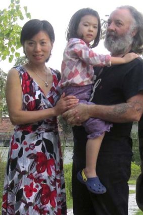 Another Aussie in trouble: Carl Mather with wife Xie Qun and daughter Doreen.