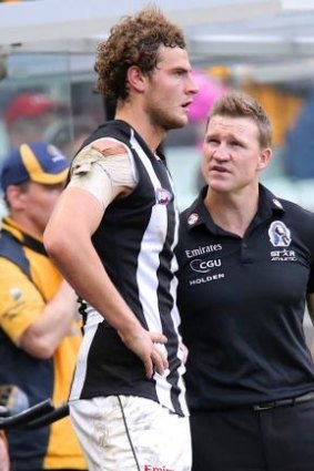 Tough talk: Nathan Buckley with Jarrod Witts during Saturday's game.