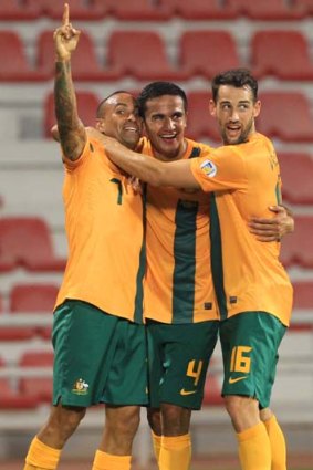 Game changers ... Archie Thompson, left and Tim Cahill with fellow Socceroo Carl Valeri, right.