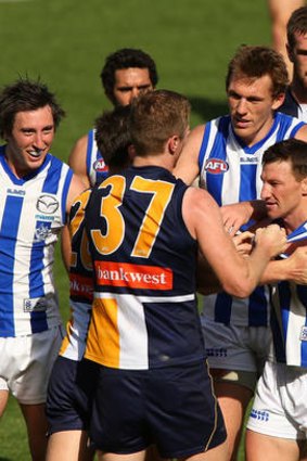 Adam Selwood exchanges words with Brent Harvey during the first Elimination Final.