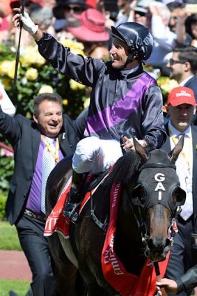 Damien Oliver returns to the scales on Fiorente after winning the 2013 Melbourne Cup.