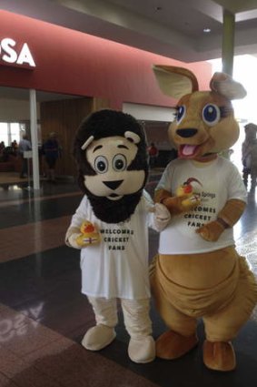 Dig: Kangaroo and lion mascots at Adelaide airport were handed rubber golden ducks bearing the English flag.