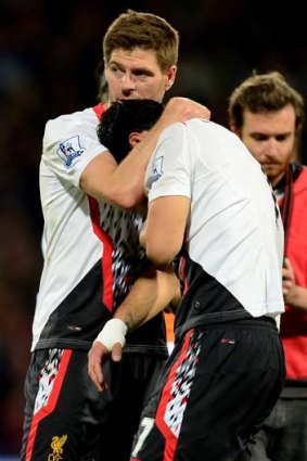 Cheer up, lad: Liverpool skipper Stephen Gerrard consoles Luis Suarez after the draw with Crystal Palace.