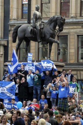 Pro-Independence supporters demonstrate in Glasgow's George Square.