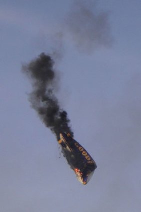 The flaming airship plunges towards the ground.