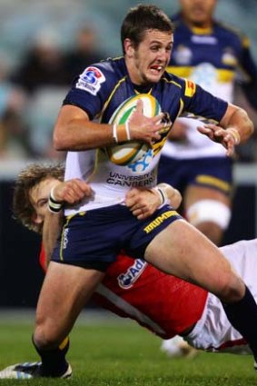 The Brumbies Ian Prior is tackled by Liam Williams of Wales.