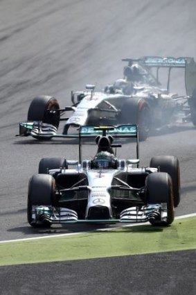 Lewis Hamilton overtakes Mercedes teammate Nico Rosberg who was forced into the escape road under brakes.