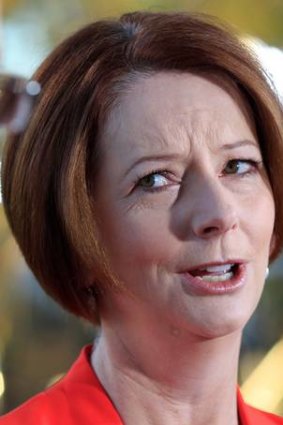 Julia Gillard says Tony Abbott has hit a 'new low in negativity'.