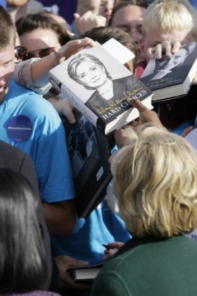 Supporters have their copies of <i>Hard Choices</i> signed by the former secretary of state.