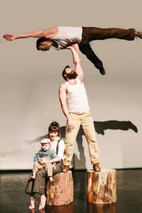 Julie Carabinier-Lepine holding three-year-old Arthur Casaubon and (middle) Antoine Carabinier-Lepine lifting  Jonathan Casaubon in TIMBER! by Canadian circus company Cirque Alfonse 