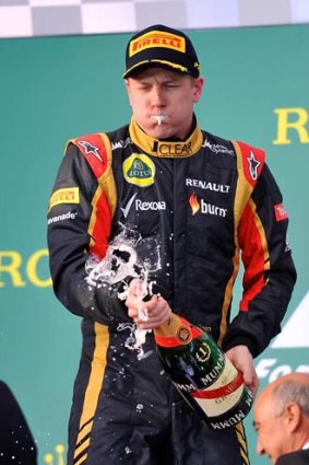 Kimi Raikkonen celebrates on the podium after winning the Australian Grand Prix.
