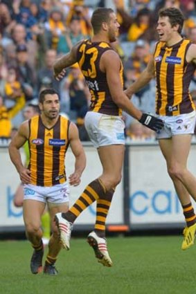 Hawks hopping happy: Lance Franklin (left) helps Isaac Smith celebrate his goal.