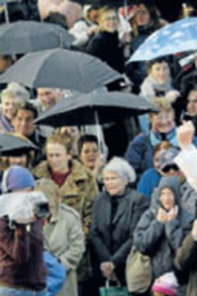 Citizens turn out to do some 'singin in the rain' at the festival's launch in 2003.