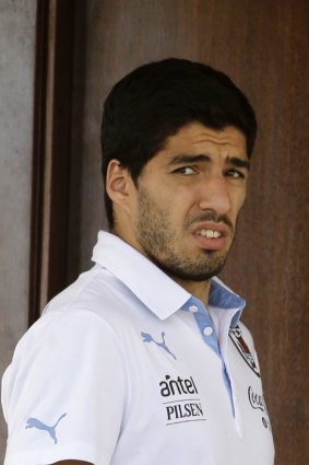 Nervous wait: Luis Suarez looks out from his hotel in Natal on Wednesday.