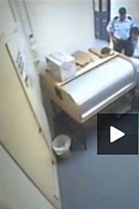 Violent arrest … a screen grab of Barker's alleged bashing at Ballina police station.