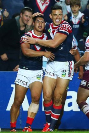 Roger Tuivasa-Sheck (L) of the Roosters celebrates with Sonny Bill Williams (R).