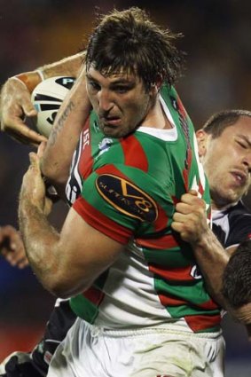 Broad shoulders ... Dave Taylor takes on the Warriors.