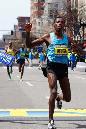 Lelisa Desisa Benti of Ethiopia crosses the finish line to win the men's division of the 117th Boston Marathon on April 15, 2013 in Boston.