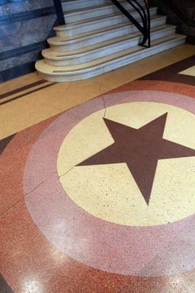 The City of Melbourne is seeking to protect the Orange Order star motif, made of patterned terrazzo, in the foyer of Centenary Hall in Exhibition Street.