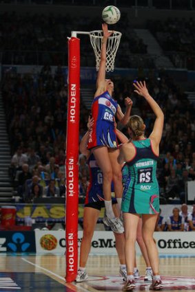 The lift: Mystic Anna Harrison gets help to stop Karyn Howarth's shot.