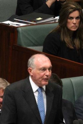Debate stuck on repeat in leaders' absence: Acting Prime Minister Warren Truss watched by Peta Credlin during question time.