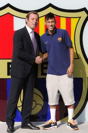 June 3, 2013: FC Barcelona's new player Brazilian Neymar da Silva Santos Junior (R) posing with then Barcelona club President Sandro Rosell at Camp Nou.