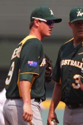 James Beresford, Chris Oxspring and Tim Kennelly of Australia confer during the game against the Netherlands.