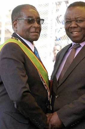 Power players … Zimbabwe’s President Robert Mugabe, at left, and Prime Minister Morgan Tsvangirai at Independence Day celebrations last year.