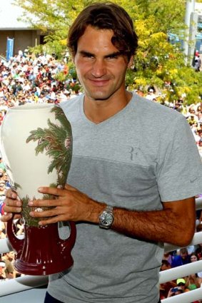 Roger Federer of Switzerland poses with the winner's trophyafter winning the Western & Southern Open.
