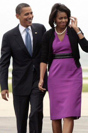 Democratic presidential hopeful Sen. Barack Obama (D-IL) (L) and his wife Michelle Obama.