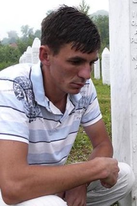 Mr Alic at the graveyard where his father and uncle are now buried.