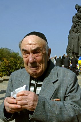 A man cries as he remembers all his family killed by Nazis at Babi Yar ravine.