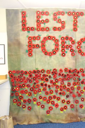 Knitted poppies in 'When Hall Answered the Call' exhibition at the Hall Museum.
