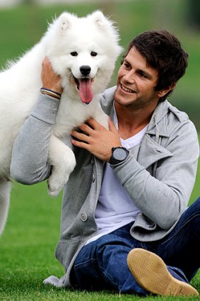 Trent Cotchin with his samoyed puppy, Kuda.