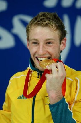 The highs ... Matthew Mitcham celebrates winning gold in Beijing.