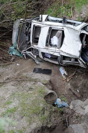 Trapped: the mangled wreckage of the van after it rolled of SH5 between Napier and Taupo near Te Haroto.