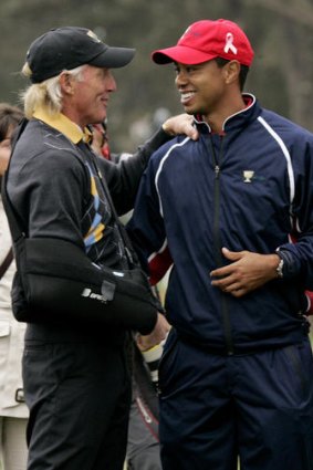 International captain Greg Norman shares a moment with Tiger Woods after his singles win to give the US victory in 2009.