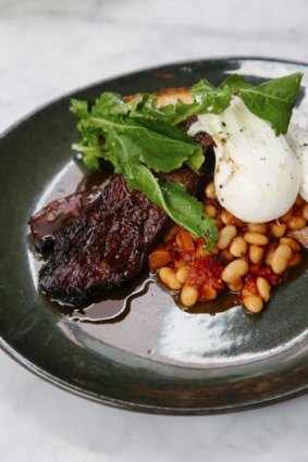 Rich flavour: Brisket slow-cooked in coffee and bourbon with poached eggs and beans.