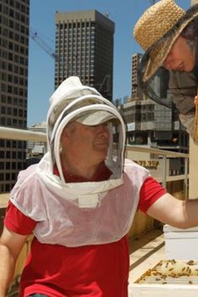 Urban bee-keepers Doug Purdie and Victoria Brown.