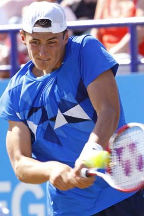 Bernard Tomic plays Fabio Fognini of Italy during the Eastbourne tournament.